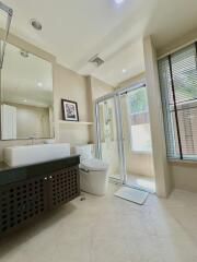 Modern bathroom with shower, sink, and toilet