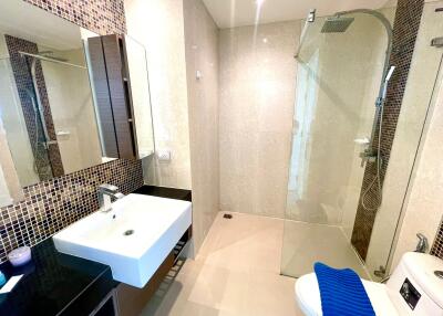 Modern bathroom with glass shower and stylish fixtures