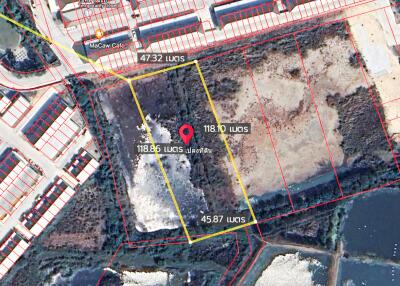 Aerial view of land plots with measurements and pin marker