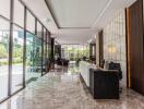 Modern office building lobby with reception desk and glass walls