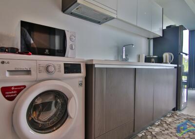 Modern kitchen with appliances and washing machine