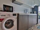 Modern kitchen with appliances and washing machine