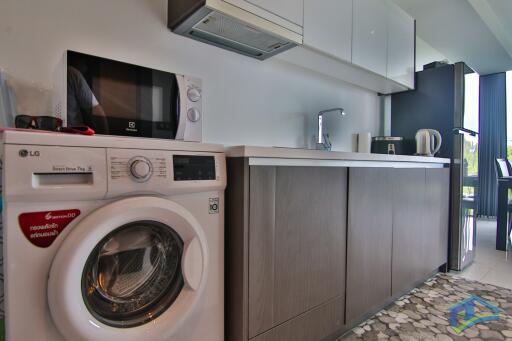 Modern kitchen with appliances and washing machine
