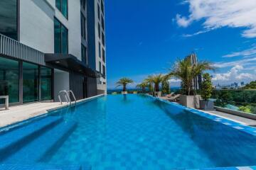 Modern high-rise building with a spacious outdoor swimming pool