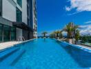 Modern high-rise building with a spacious outdoor swimming pool