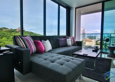 Modern living room with large windows and city view