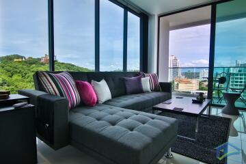 Modern living room with large windows and city view