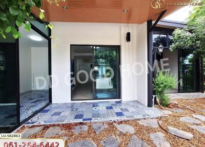 modern house exterior with patio and large windows