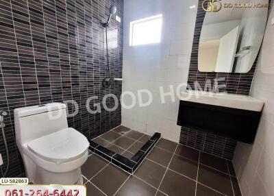 Modern bathroom with tiled walls and floor