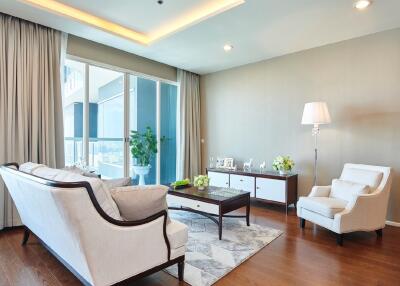 Bright and stylish living room with modern furniture and a large window.