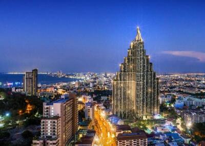 Skyline view with tall city buildings at dusk