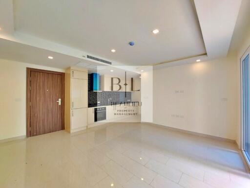 Spacious living area with an attached kitchen