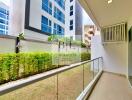 Modern apartment balcony with glass railing