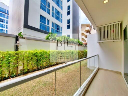 Modern apartment balcony with glass railing