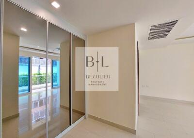 Spacious and bright hallway with mirrored closets