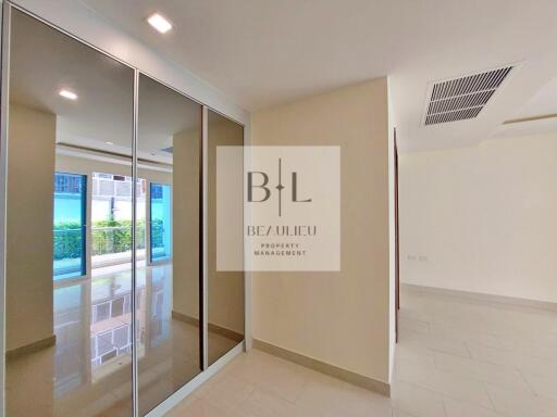 Spacious and bright hallway with mirrored closets