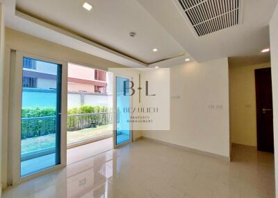 Bright and spacious living room with large glass doors