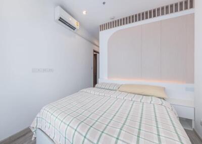 Modern bedroom with air conditioner and minimalist decor