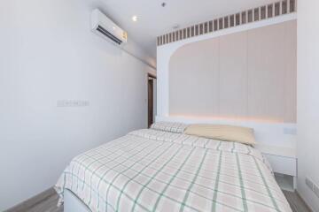 Modern bedroom with air conditioner and minimalist decor