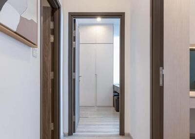 Modern hallway with artwork and doors leading to other rooms