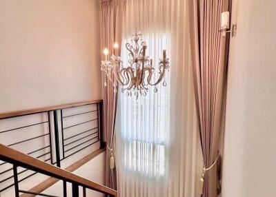 Elegant staircase with chandelier