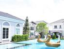 Outdoor swimming pool with inflatable swan floaties