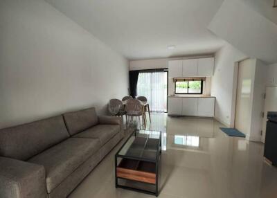 Modern living room with dining area and minimalist decor