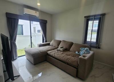 Modern living room with sectional sofa and flat-screen TV