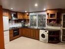 Modern kitchen with wooden cabinetry and appliances