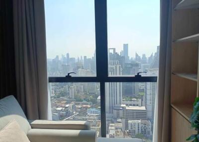 Living room with large window and city view