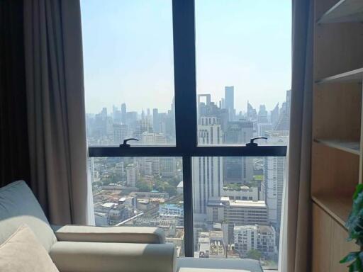 Living room with large window and city view