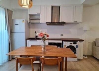 Small kitchen with wooden dining table