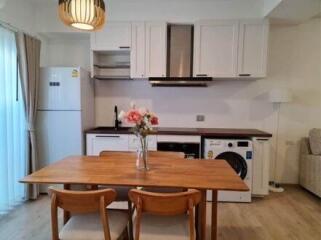 Small kitchen with wooden dining table