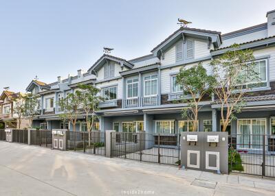 Front view of modern townhouses with driveway