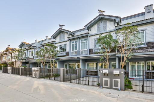 Front view of modern townhouses with driveway