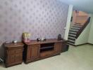 Living room with wooden furniture and staircase