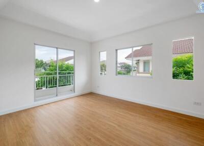 Spacious living room with large windows and natural light