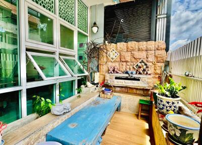 Spacious balcony with artisanal decor and plants