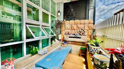Spacious balcony with artisanal decor and plants