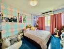 A colorful and cozy bedroom with a double bed and personal decor