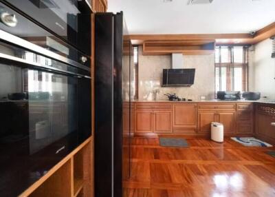 Spacious wooden kitchen with modern appliances