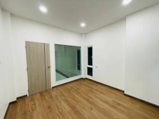 Bright empty room with wooden floor