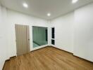 Bright empty room with wooden floor