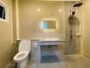 Modern clean bathroom with shower, toilet, and sink