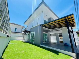 Modern two-story house with garden