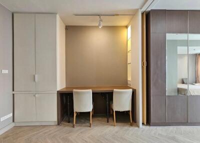 Bedroom with work desk and chairs