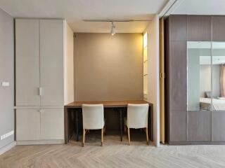 Bedroom with work desk and chairs