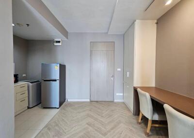 Main living area with kitchenette and dining space