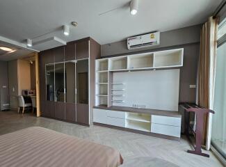 Spacious modern bedroom with storage and built-in air conditioner