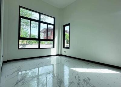 Spacious living room with large windows